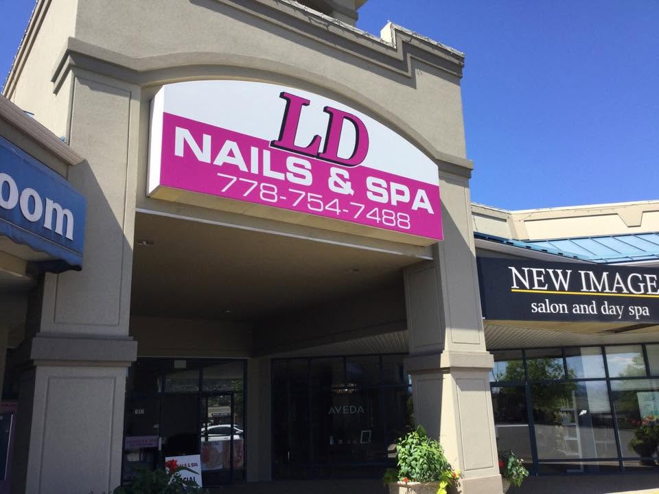 The LD Nails & Spa storefront sign on Gossett Road